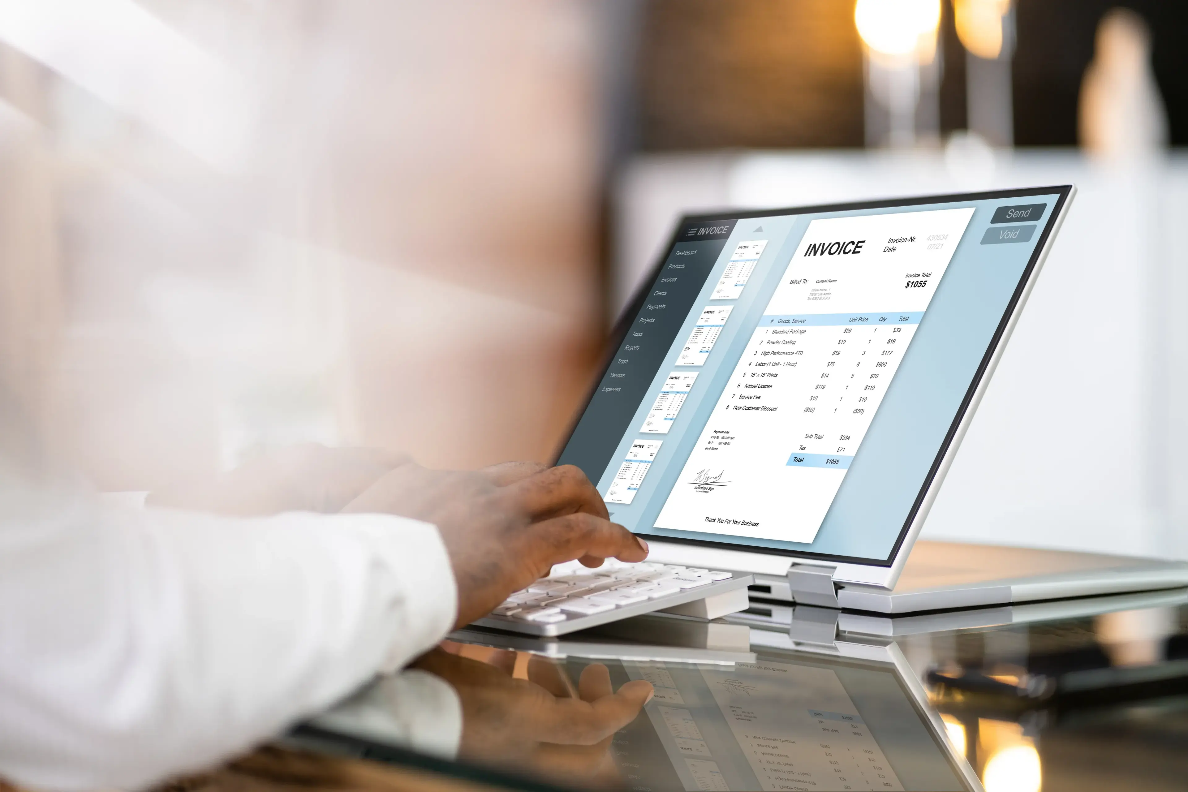 Person reviews a digital invoice on a laptop